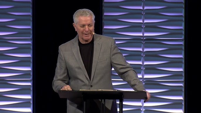 Family playing soccer with their child