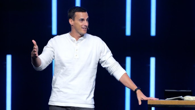 Woman raising her hand in crowd