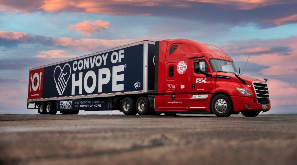 Group of young boys packing food bags