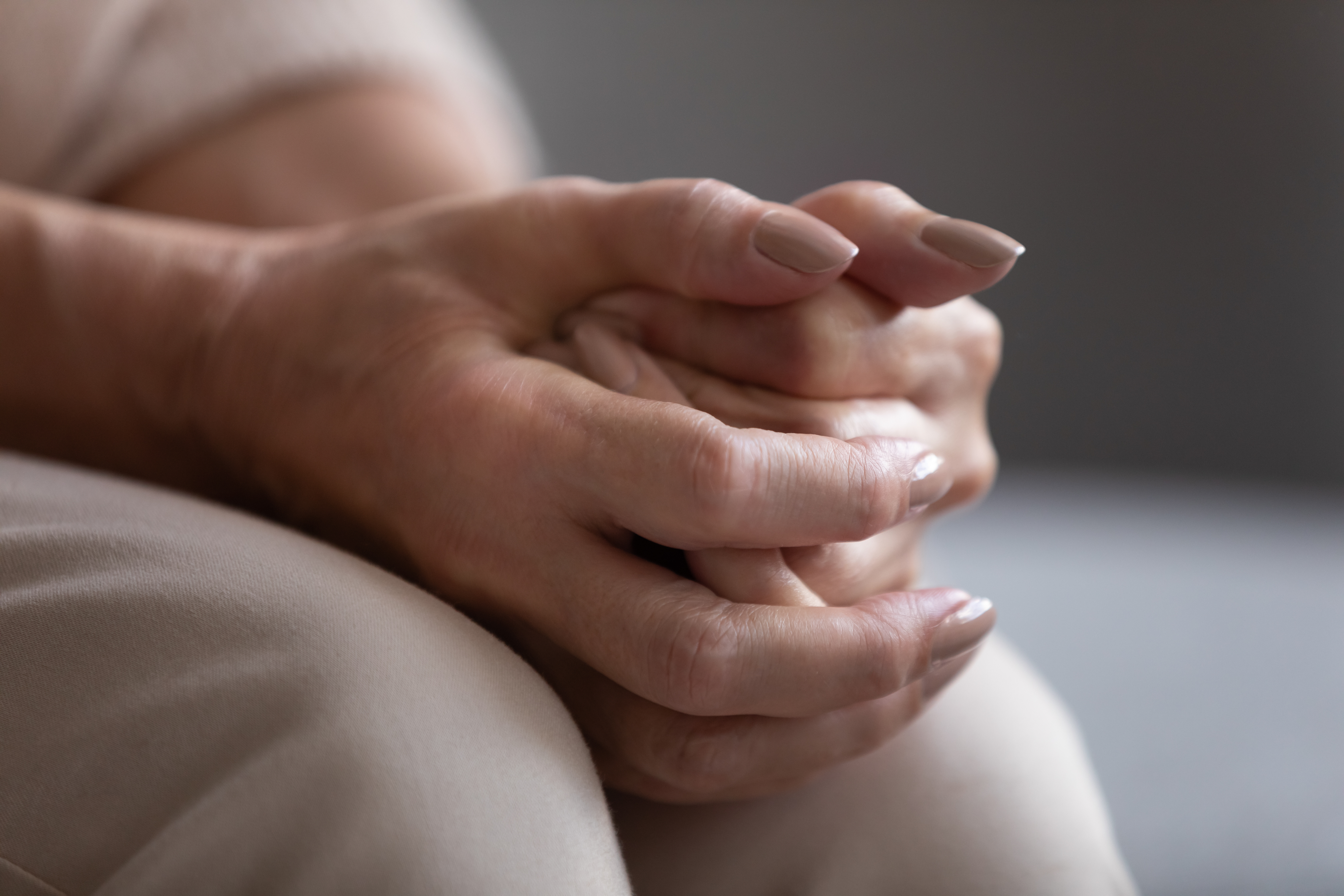 Two people holding hands