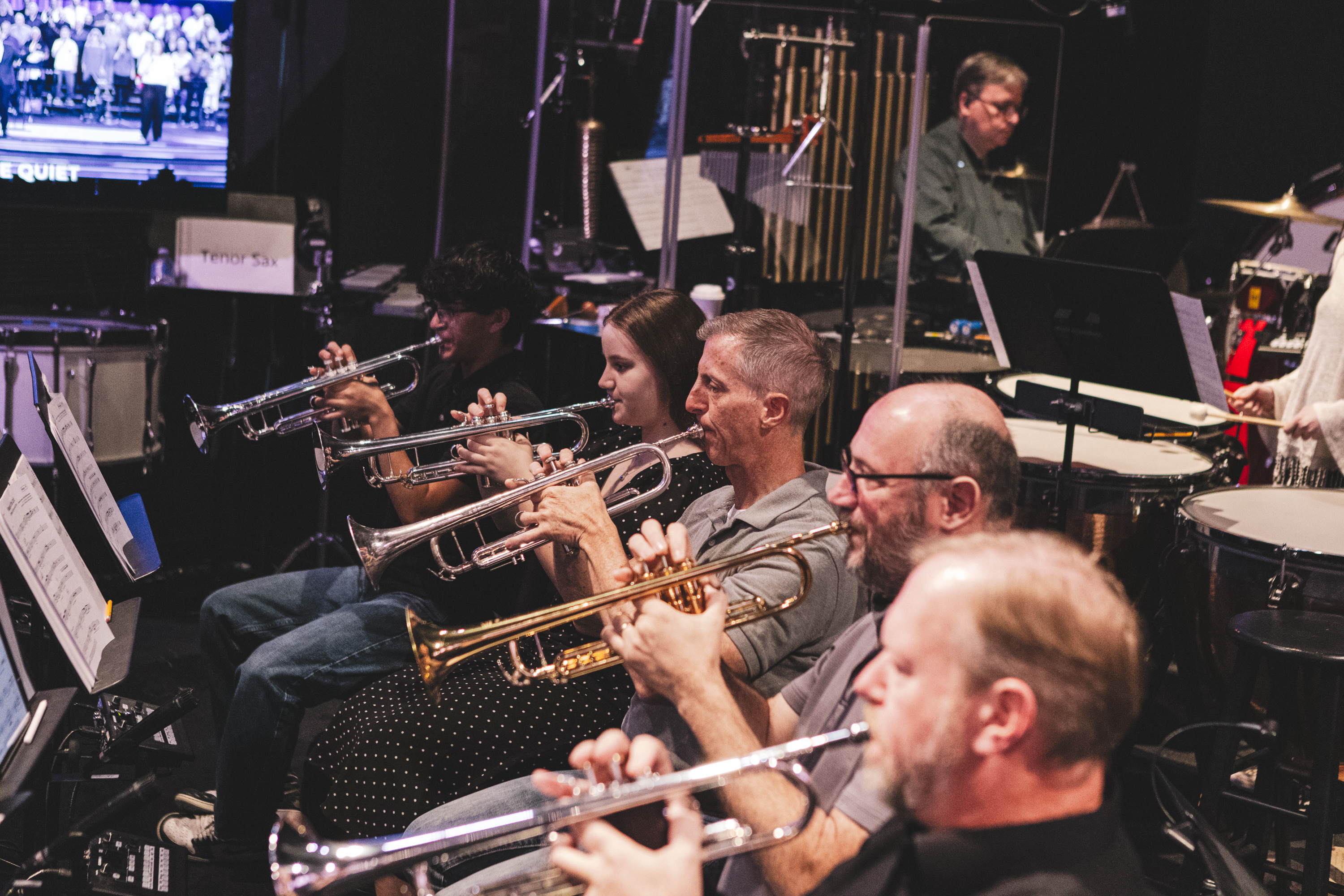 Woman with arms raised in worship