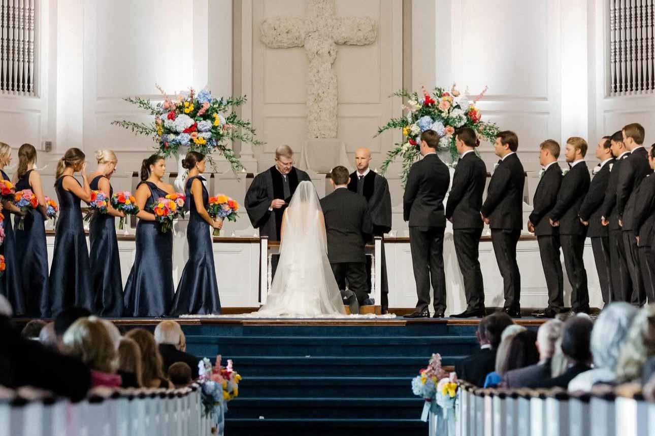 Man and woman just married walking down the asle