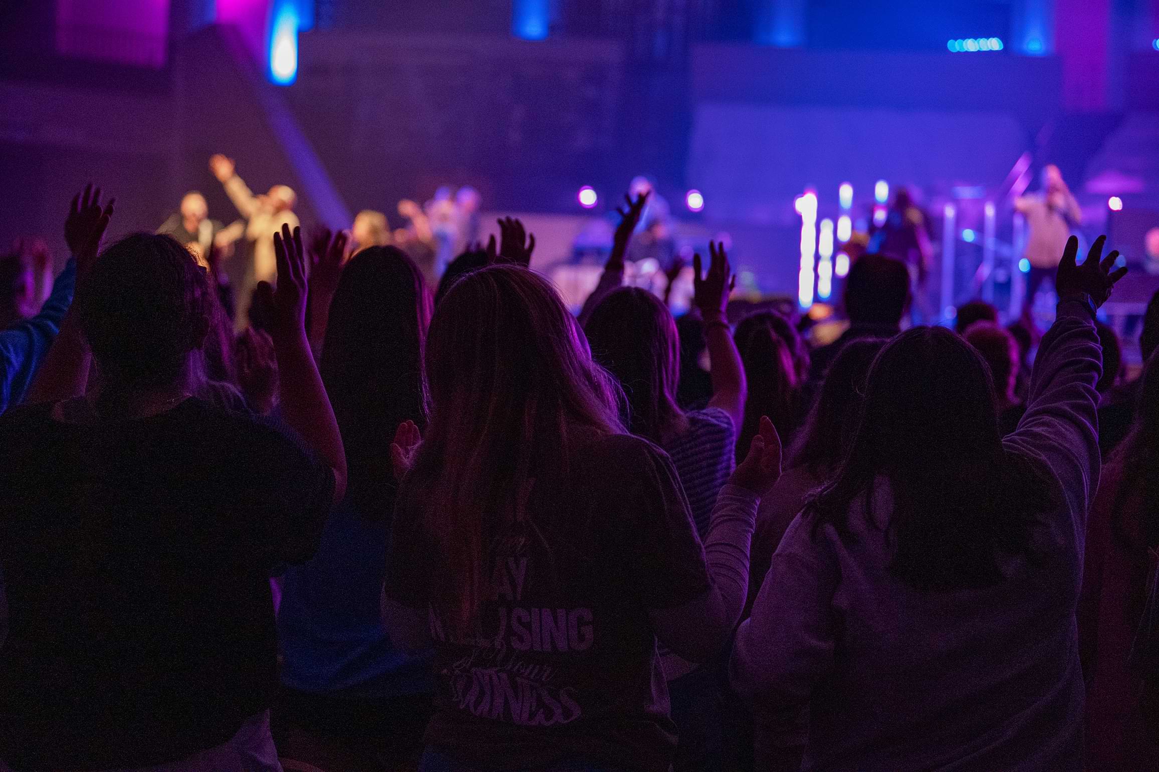 People with their backs turned in worship